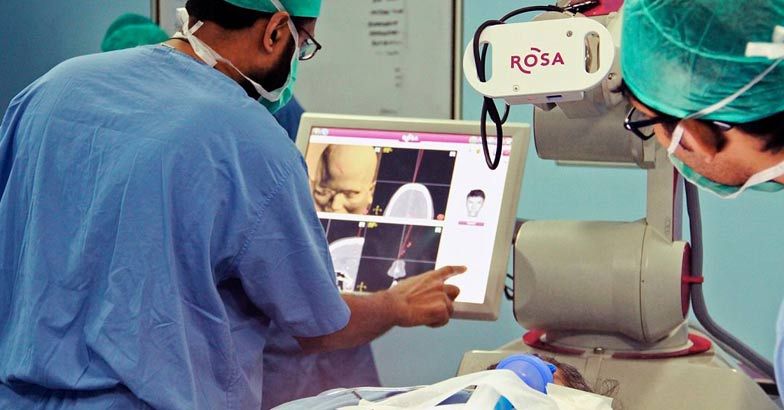 Auto driver beats Parkinson's after first robotic assisted DBS surgery ...